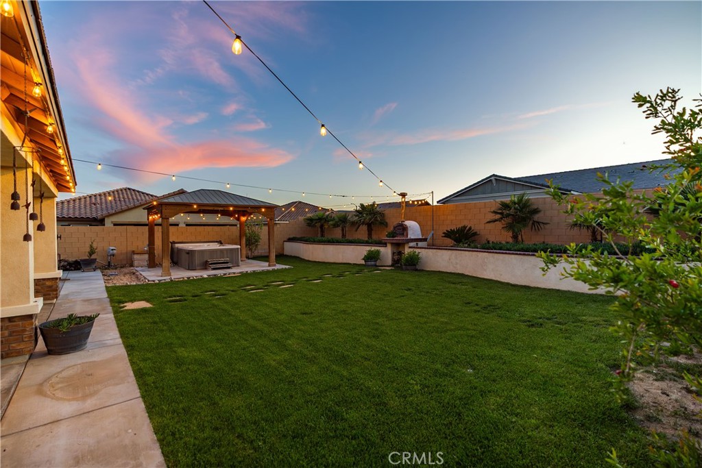 44451 63rd Street West Lancaster, CA 93536 - Photo 30 of 47 a view of a garden with a house