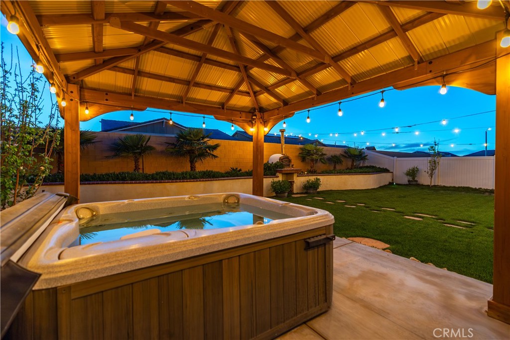 44451 63rd Street West Lancaster, CA 93536 - Photo 33 of 47 a view of a patio with a table and chairs under an umbrella