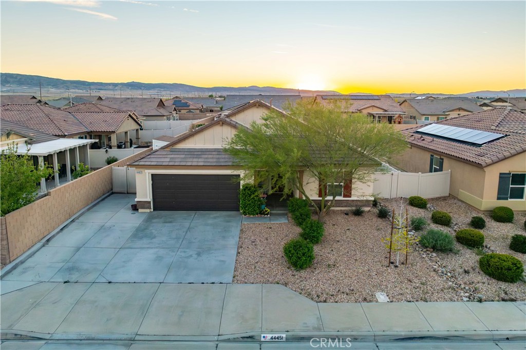 44451 63rd Street West Lancaster, CA 93536 - Photo 43 of 47 an aerial view of a house with a yard and potted plants