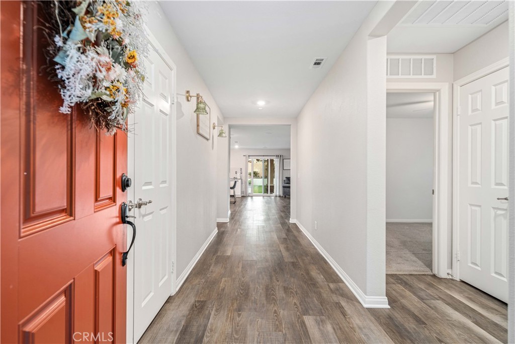 44451 63rd Street West Lancaster, CA 93536 - Photo 6 of 47 a view of hallway with wooden floor and stairs