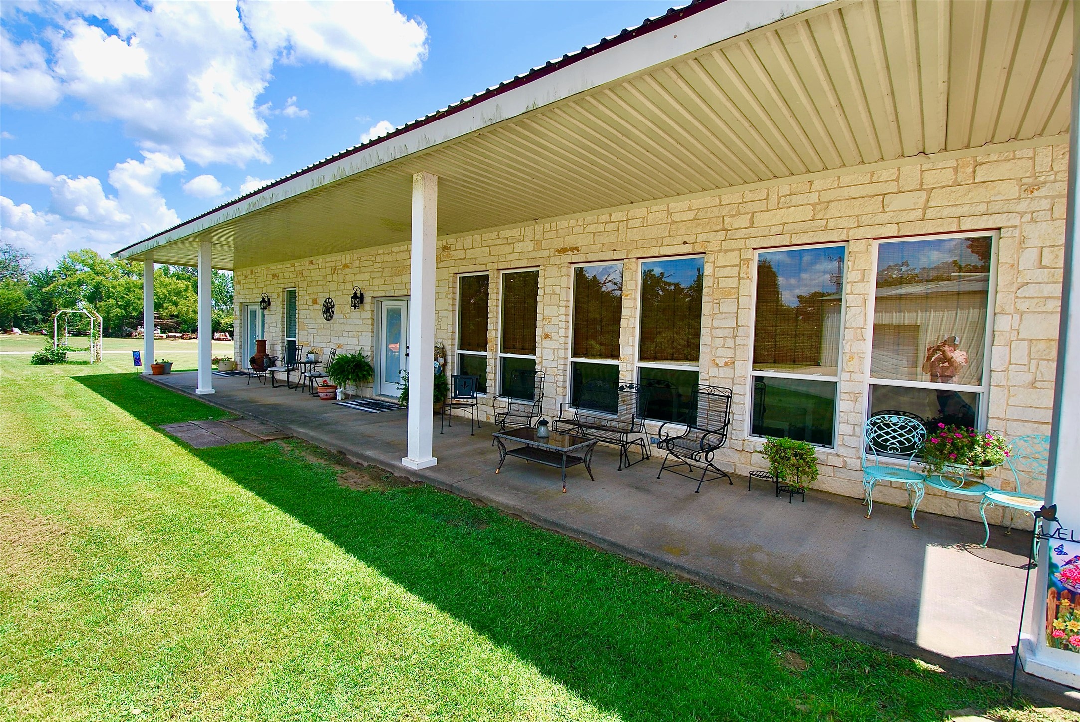 27368 Highway 19 Athens, TX 75752 - Photo 2 of 47 a front view of a house with a garden and patio