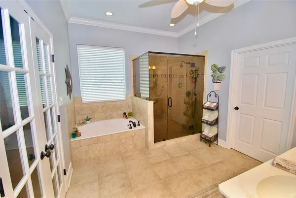 a spacious bathroom with a double vanity sink and a mirror