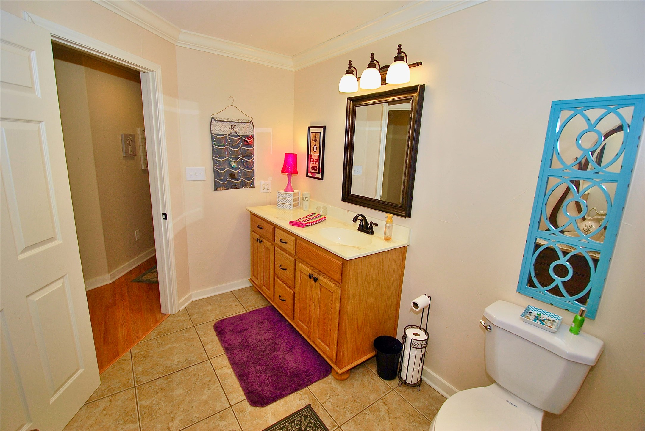 27368 Highway 19 Athens, TX 75752 - Photo 37 of 47 a bathroom with a sink mirror vanity and toilet