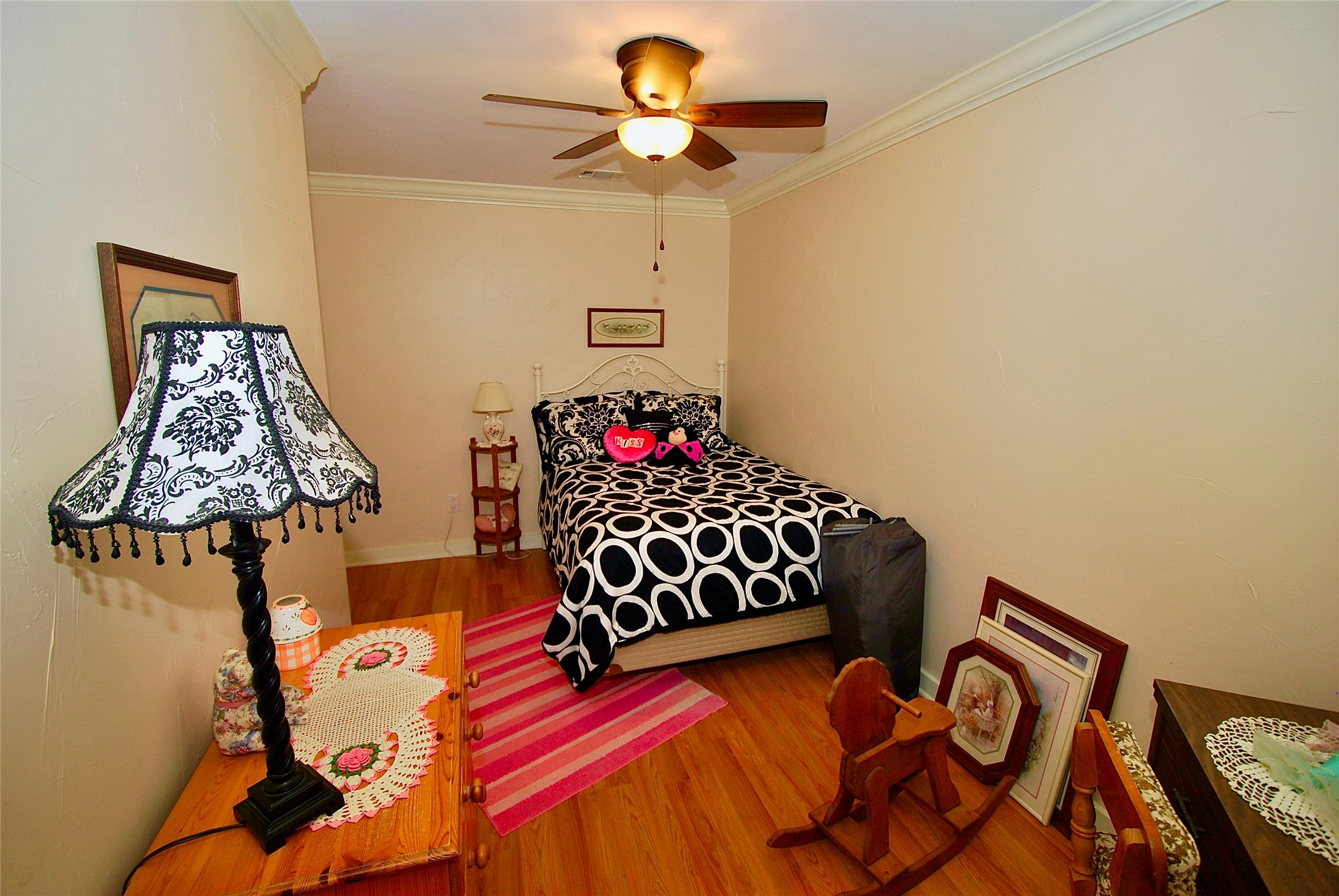 27368 Highway 19 Athens, TX 75752 - Photo 39 of 47 a bedroom with a bed and a chandelier