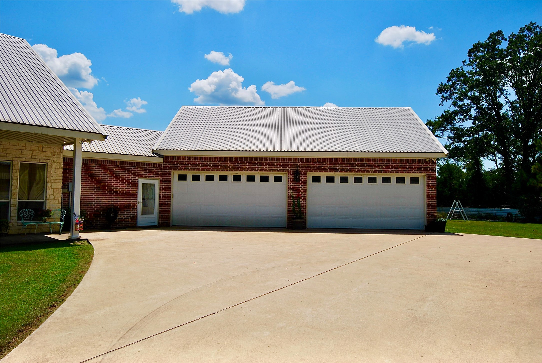27368 Highway 19 Athens, TX 75752 - Photo 5 of 47 a front view of a building with a yard and garage