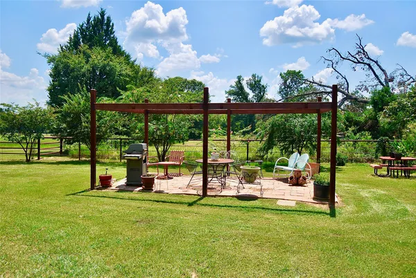 a view of a park with furniture