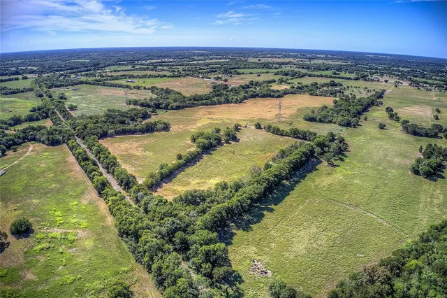 a view of a lake with a yard