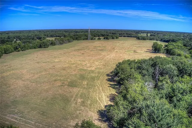 a bathroom with a shower and a mirror