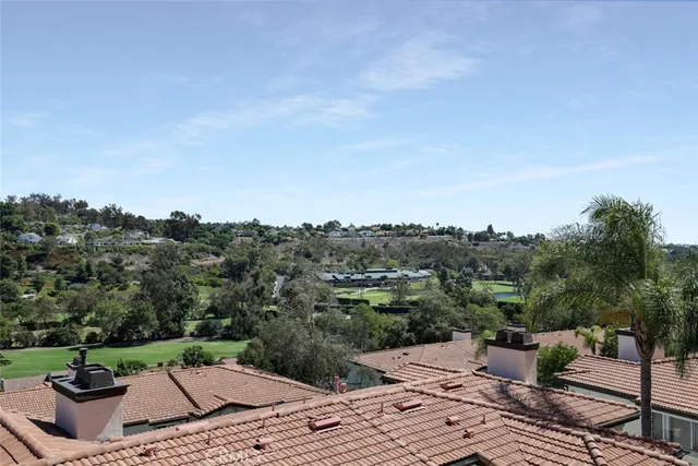 a view of a terrace with a bench and mountain