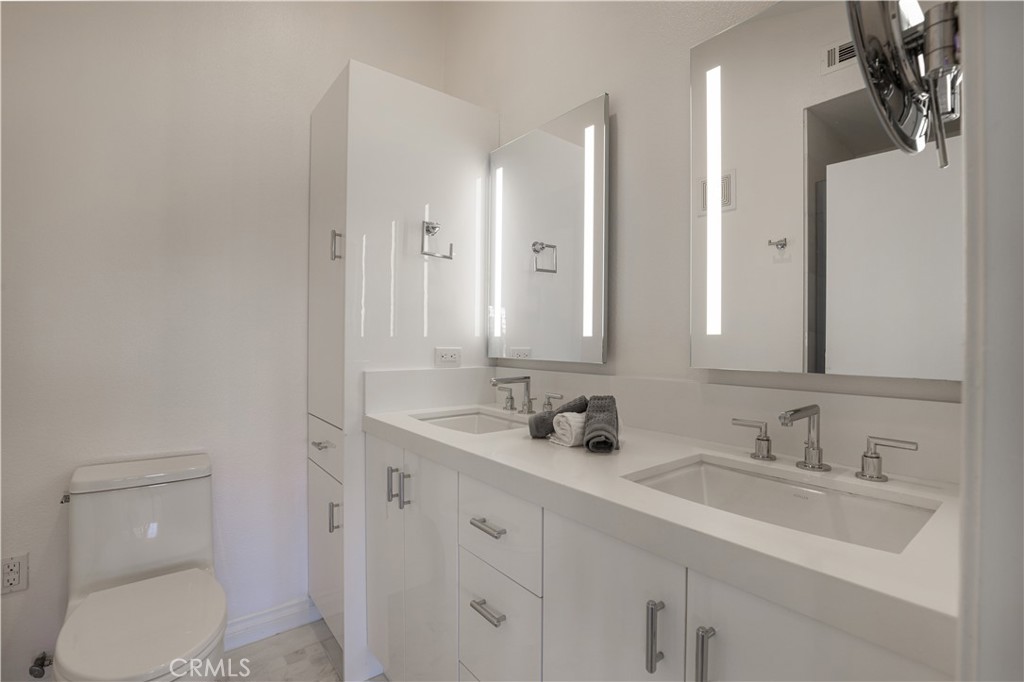 30902 Club House Drive, Unit 11J Laguna Niguel, CA 92677 - Photo 11 of 32 a bathroom with a sink and a toilet