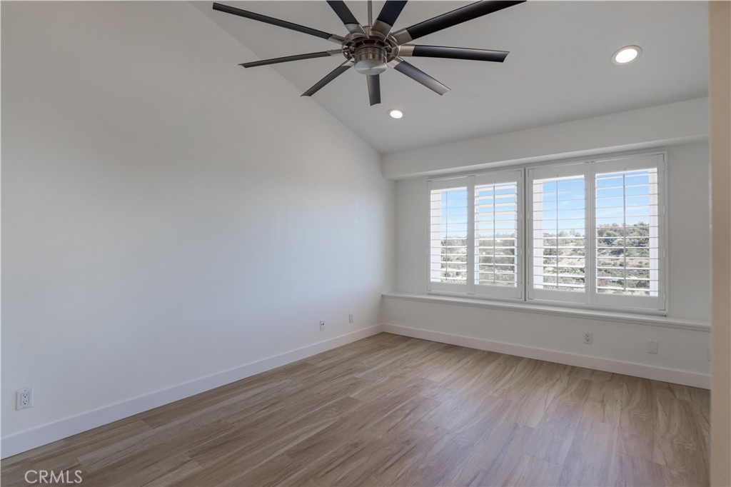 30902 Club House Drive, Unit 11J Laguna Niguel, CA 92677 - Photo 12 of 32 wooden floor in an empty room with a window