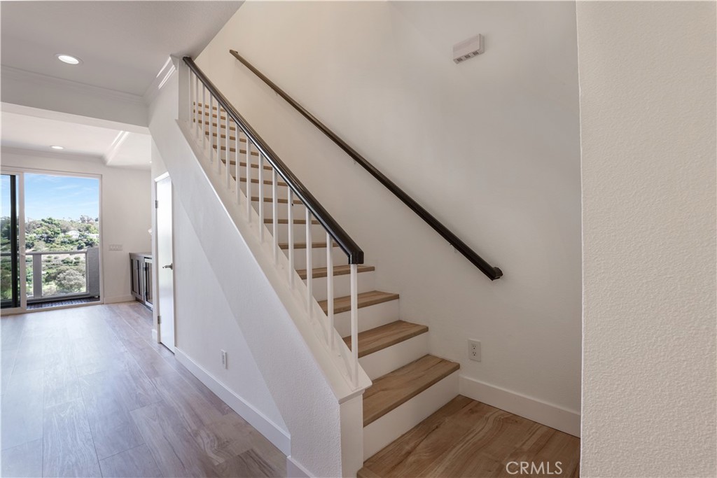 30902 Club House Drive, Unit 11J Laguna Niguel, CA 92677 - Photo 24 of 32 a view of entryway and hall with wooden floor