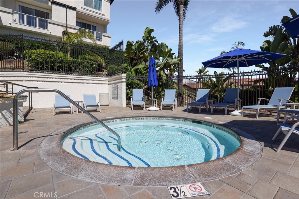 30902 Club House Drive, Unit 11J Laguna Niguel, CA 92677 - Photo 30 of 32 a view of a swimming pool with a patio