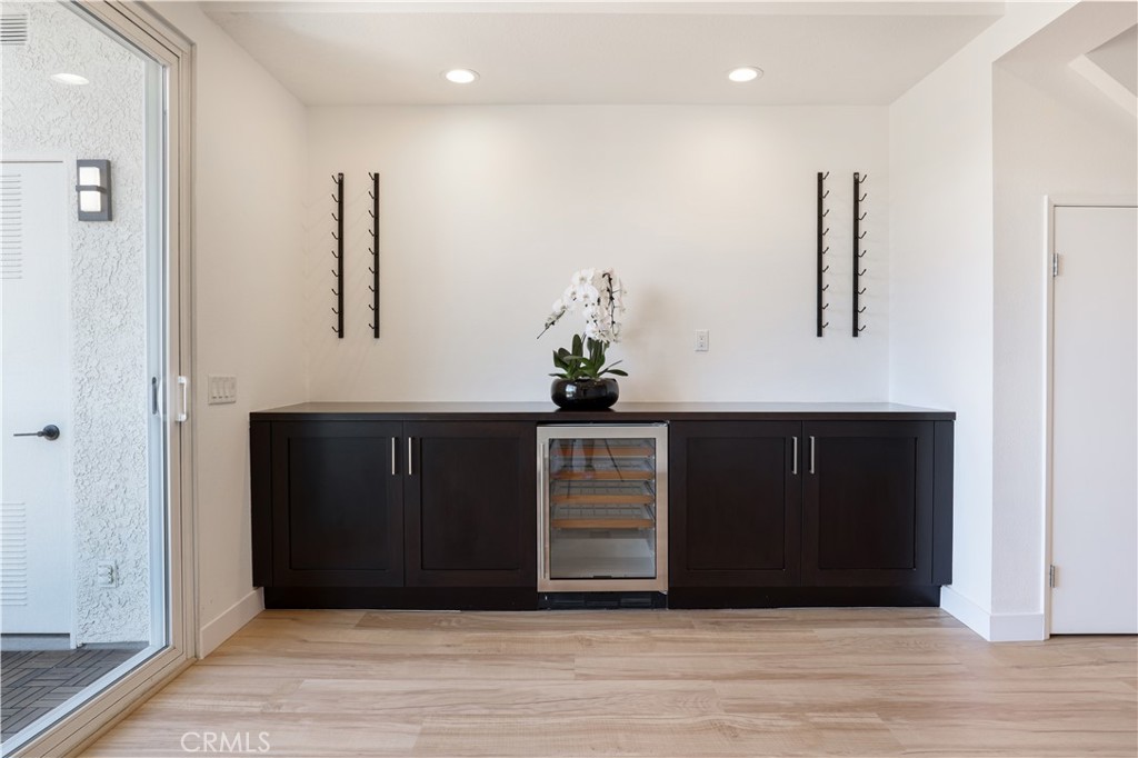 30902 Club House Drive, Unit 11J Laguna Niguel, CA 92677 - Photo 3 of 32 a view of a hallway with wooden floor