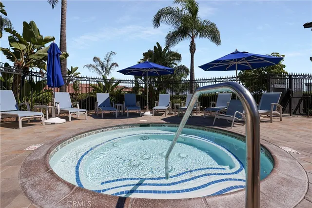 a view of a swimming pool with a patio