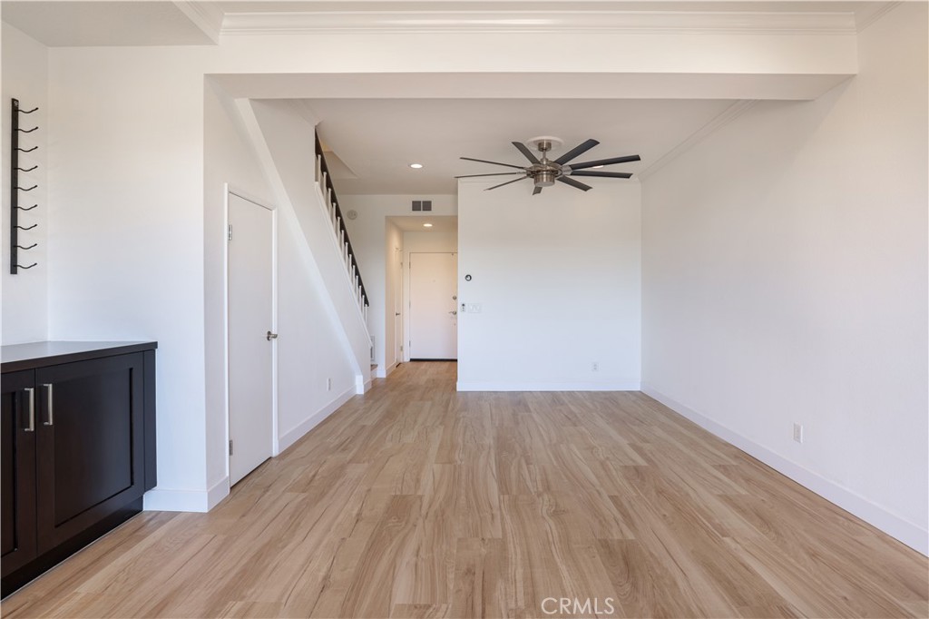 30902 Club House Drive, Unit 11J Laguna Niguel, CA 92677 - Photo 5 of 32 wooden floor in an empty room with a window