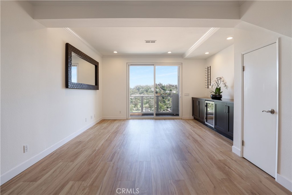 30902 Club House Drive, Unit 11J Laguna Niguel, CA 92677 - Photo 7 of 32 a view of a big room with wooden floor and windows