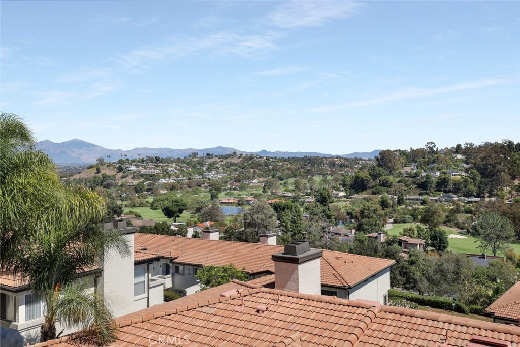 30902 Club House Drive, Unit 11J Laguna Niguel, CA 92677 - Photo 10 of 32 an aerial view of a house with a yard and mountain view in back