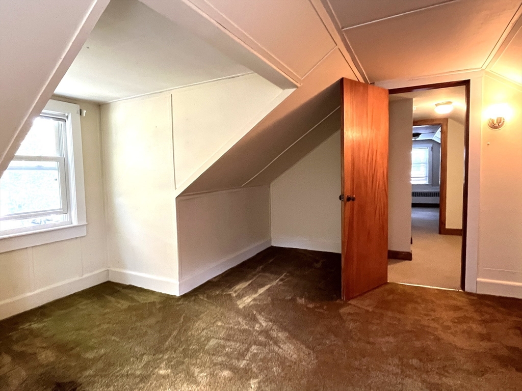 48 Ashton Street Beverly, MA 01915 - Photo 23 of 24 an empty room with windows and closet