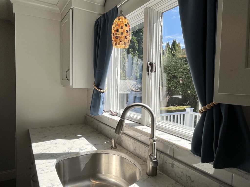 48 Ashton Street Beverly, MA 01915 - Photo 7 of 24 a close view of sink and tap