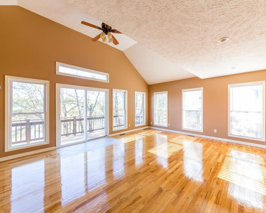 323 Mayhew Road Clarksville, TN 37040 - Photo 12 of 30 a view of an empty room with wooden floor and a window