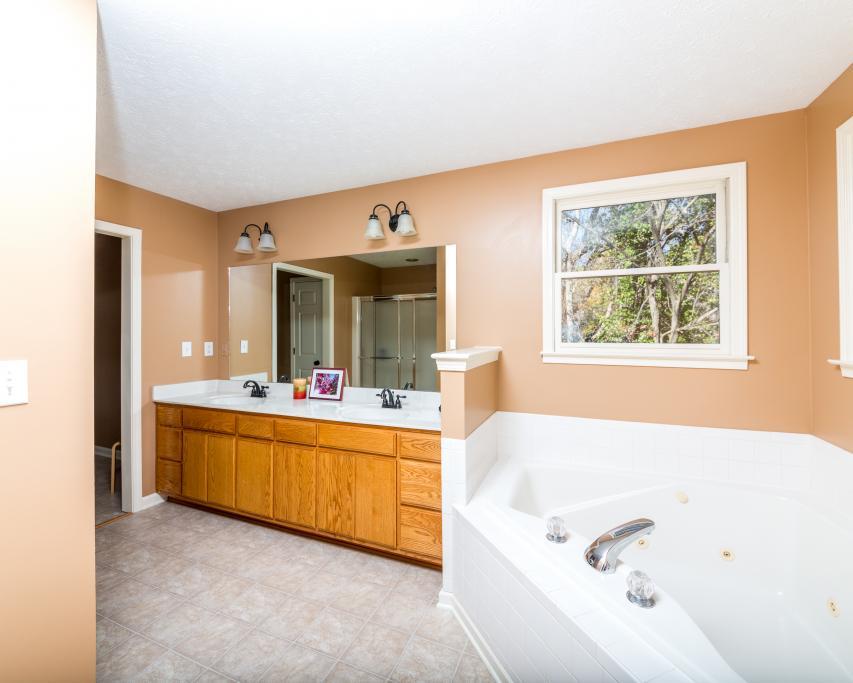 323 Mayhew Road Clarksville, TN 37040 - Photo 18 of 30 a large spacious bathroom with a tub double vanity sink and mirror