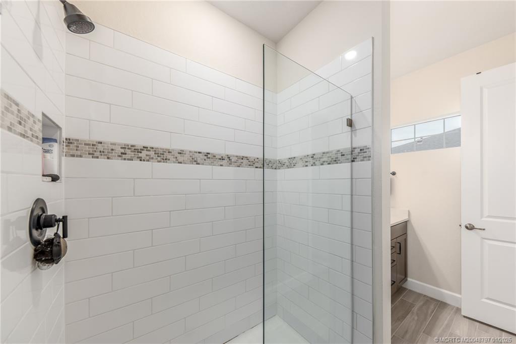1865 Southeast Tarni Way Stuart, FL 34996 - Photo 13 of 23 a bathroom with a shower