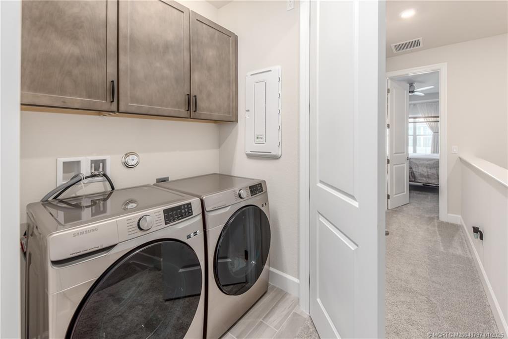 1865 Southeast Tarni Way Stuart, FL 34996 - Photo 17 of 23 a utility room with dryer and washer