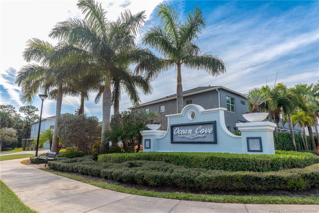 1865 Southeast Tarni Way Stuart, FL 34996 - Photo 20 of 23 a view of a street with a building in front of it