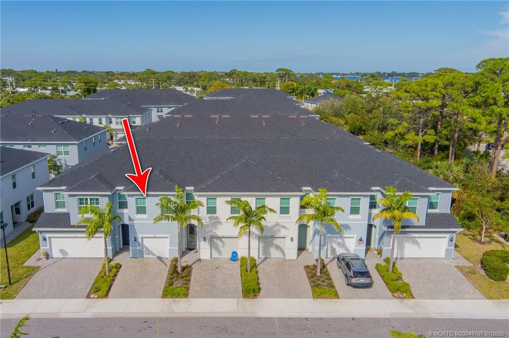 1865 Southeast Tarni Way Stuart, FL 34996 - Photo 21 of 23 an aerial view of a house with a garden and outdoor seating