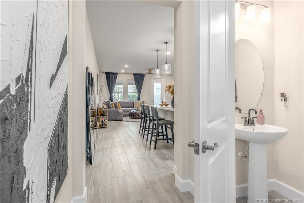 1865 Southeast Tarni Way Stuart, FL 34996 - Photo 10 of 23 a living room with furniture and a table