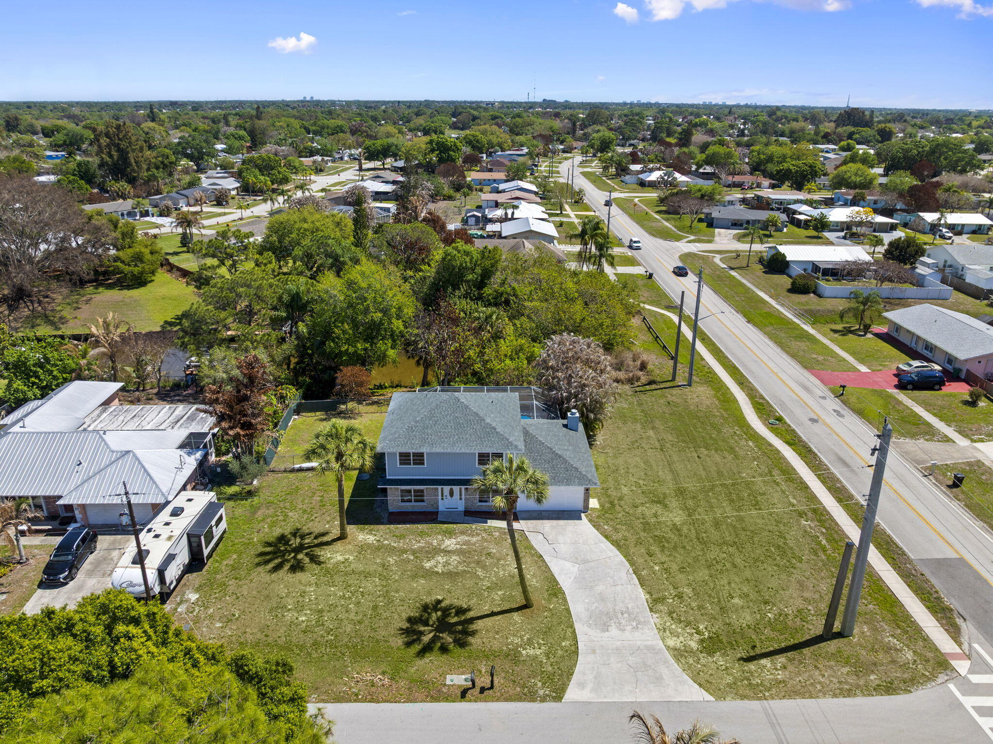 405 Northeast Midvale Street Port St. Lucie, FL 34983 - Photo 4 of 60 Curb Shot Drone (2)