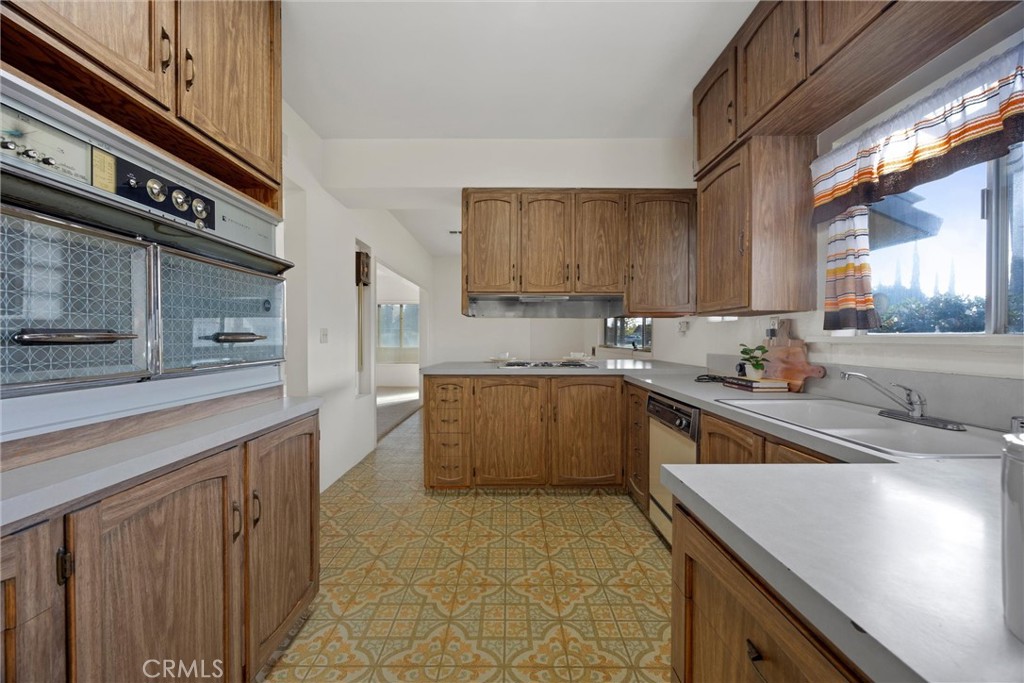 240 South Real Road Bakersfield, CA 93309 - Photo 12 of 35 a kitchen with a sink and cabinets