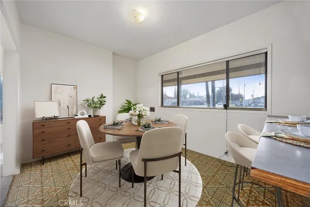 a kitchen with kitchen island granite countertop a sink a stove and a cabinets