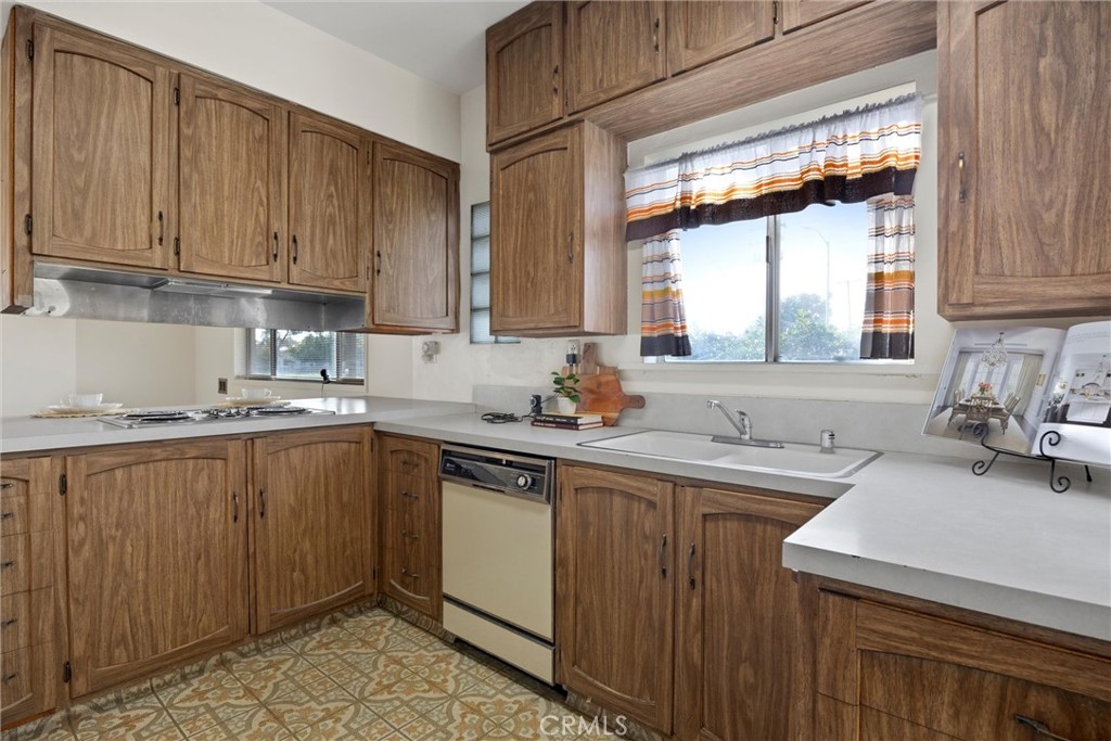 240 South Real Road Bakersfield, CA 93309 - Photo 13 of 35 a kitchen with a sink cabinets appliances and a window