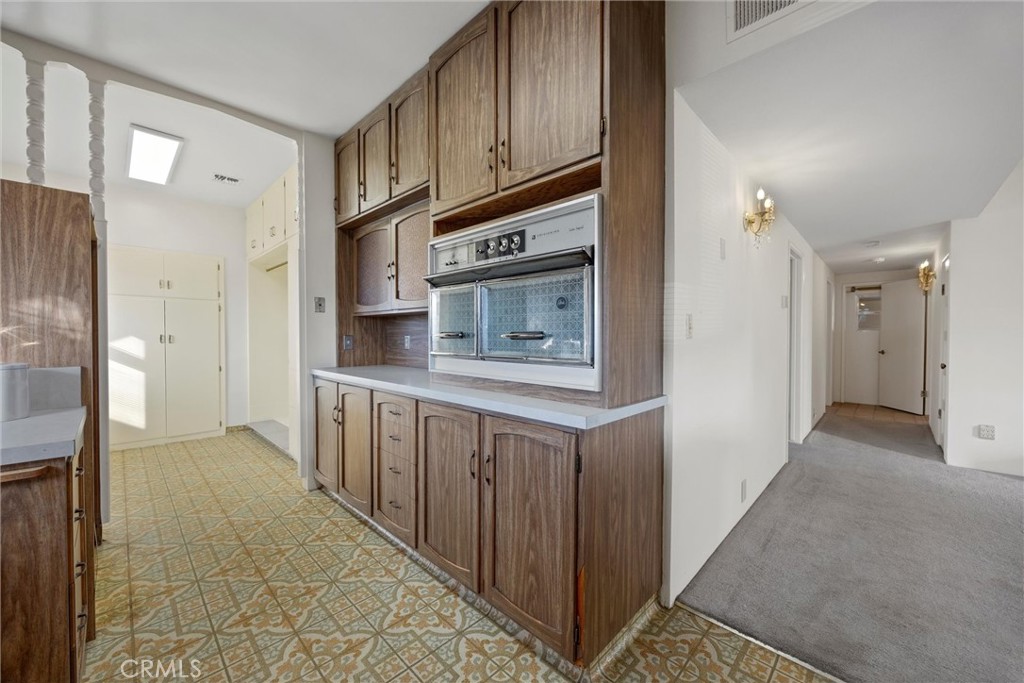 240 South Real Road Bakersfield, CA 93309 - Photo 14 of 35 a kitchen with stainless steel appliances granite countertop a refrigerator and a stove top oven