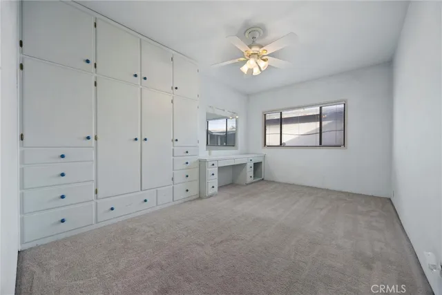 a view of a livingroom with furniture and a window