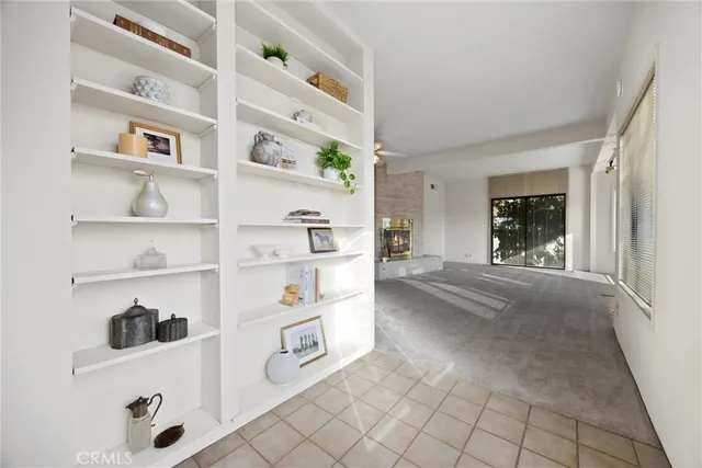 a view of a hallway with lots of books