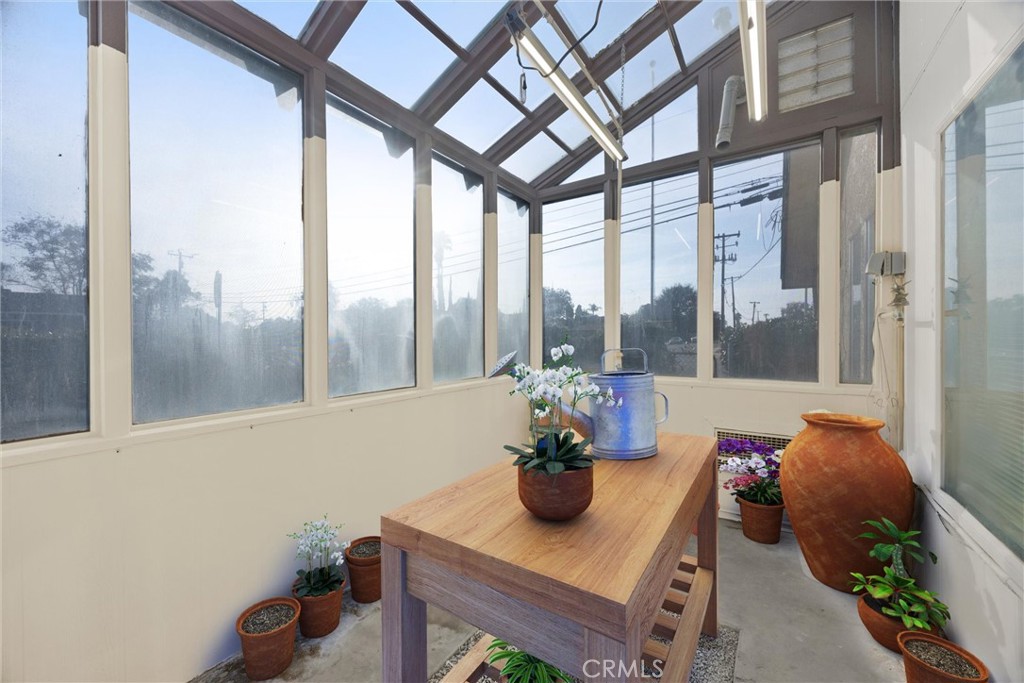 240 South Real Road Bakersfield, CA 93309 - Photo 8 of 35 a dining room with furniture and a potted plant
