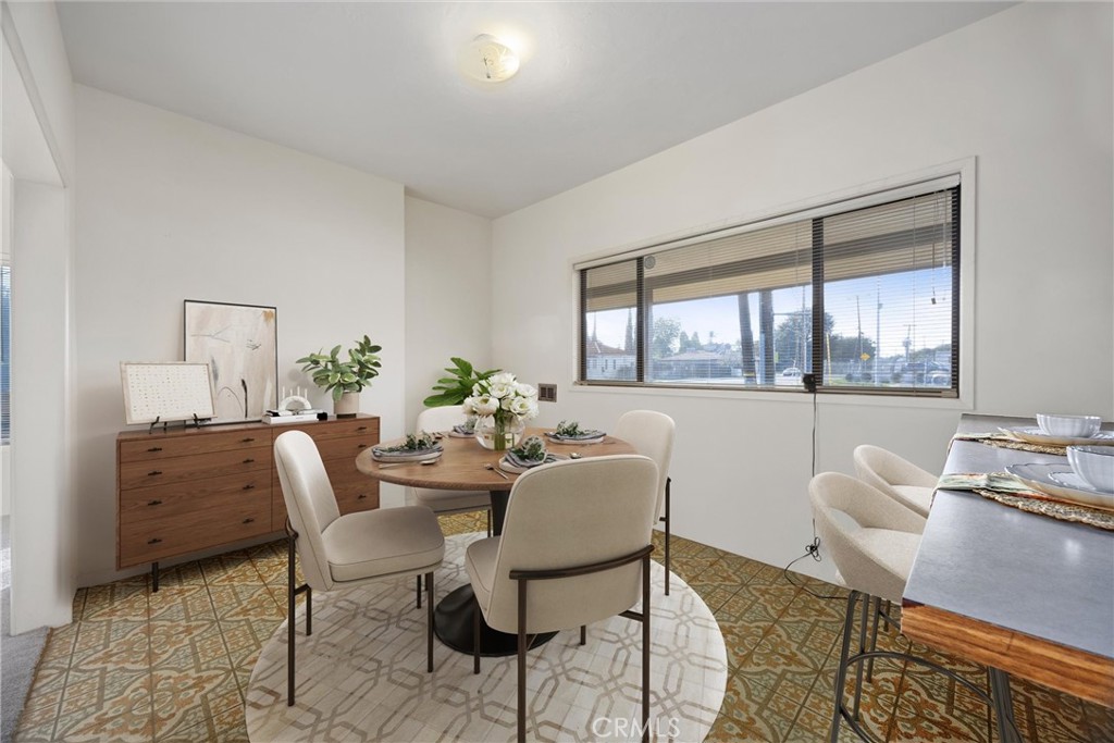240 South Real Road Bakersfield, CA 93309 - Photo 9 of 35 a dining room with furniture a rug and wooden floor