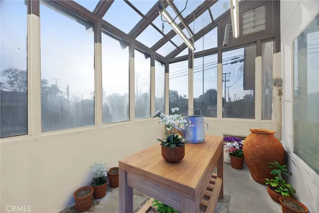 a dining room with furniture a rug and wooden floor