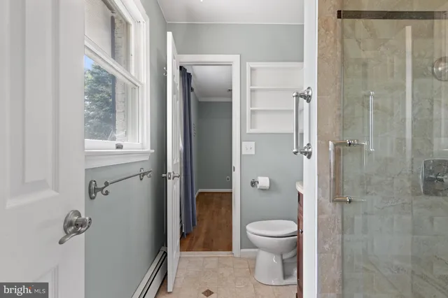 a bathroom with a sink a mirror and a shower