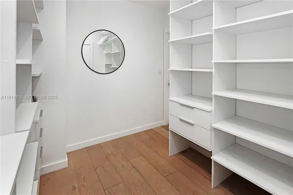 a view of a room with racks on the wall