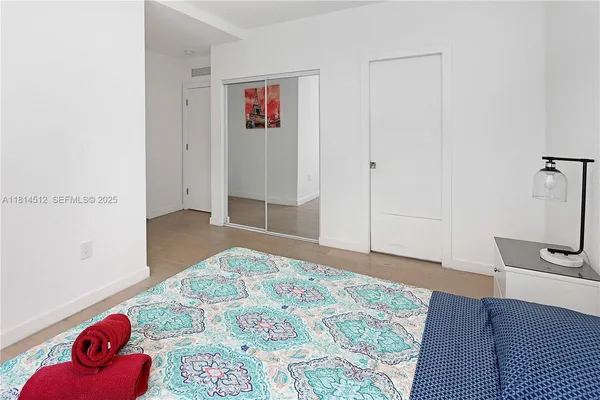 a bedroom with a bed and a couch