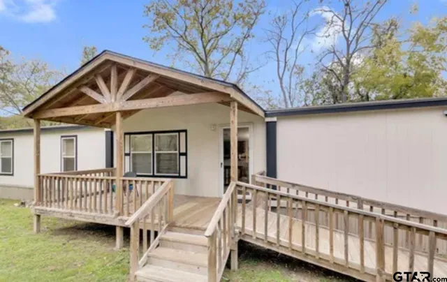 a view of a house with a deck