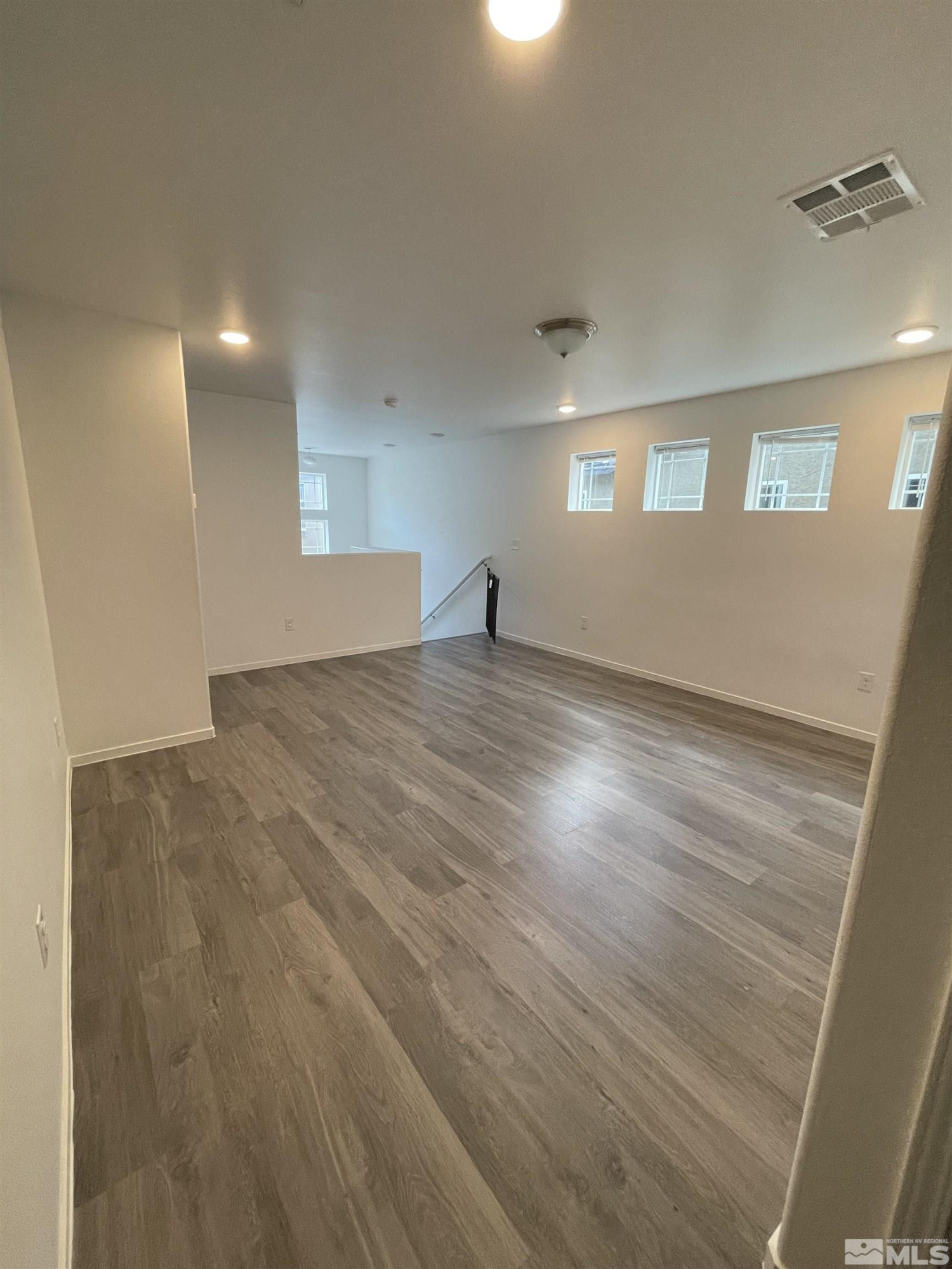 9622 Windjammer Way Reno, NV 89506 - Photo 7 of 15 a view of empty room with wooden floor