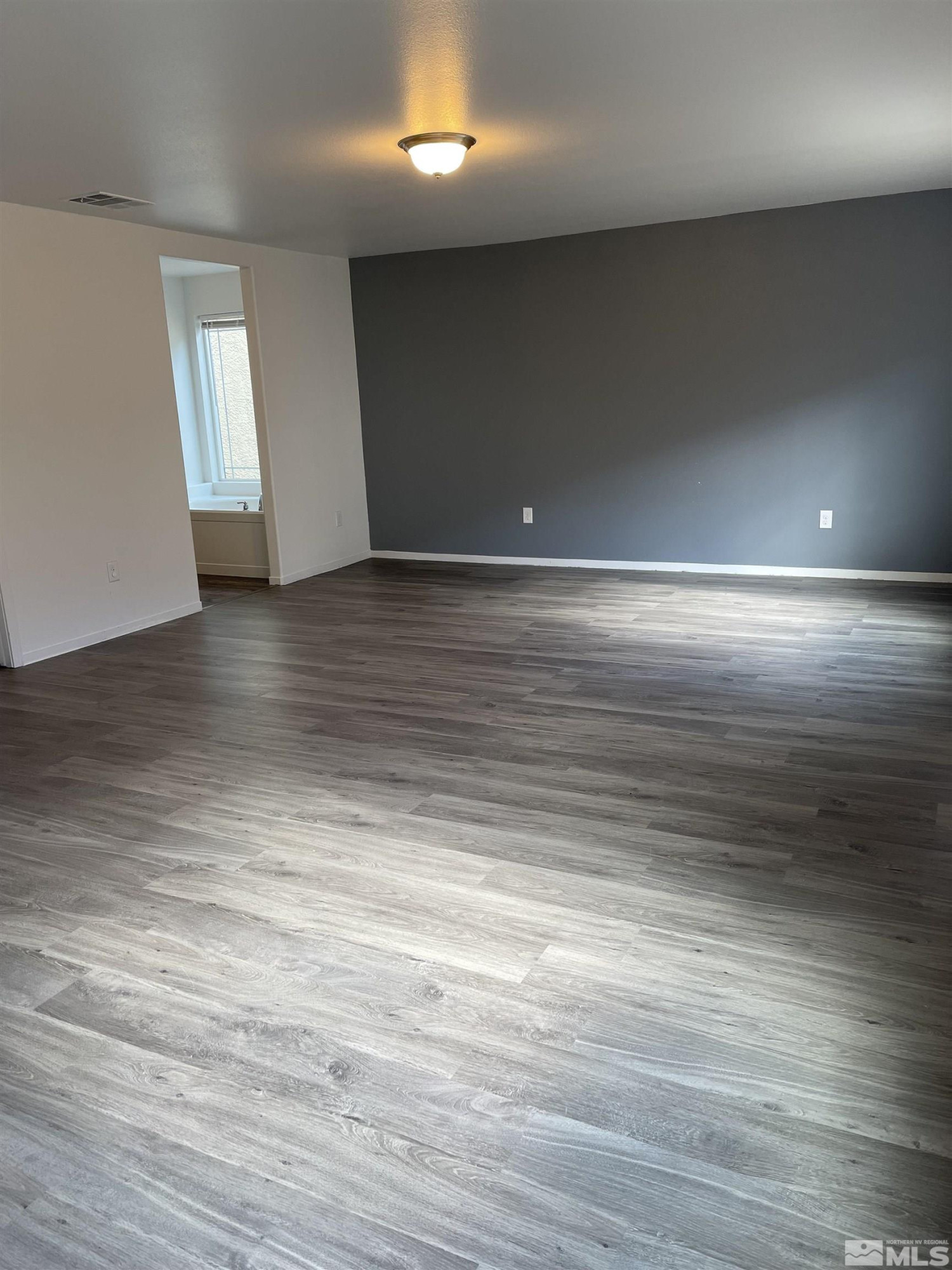 9622 Windjammer Way Reno, NV 89506 - Photo 9 of 15 an empty room with wooden floor