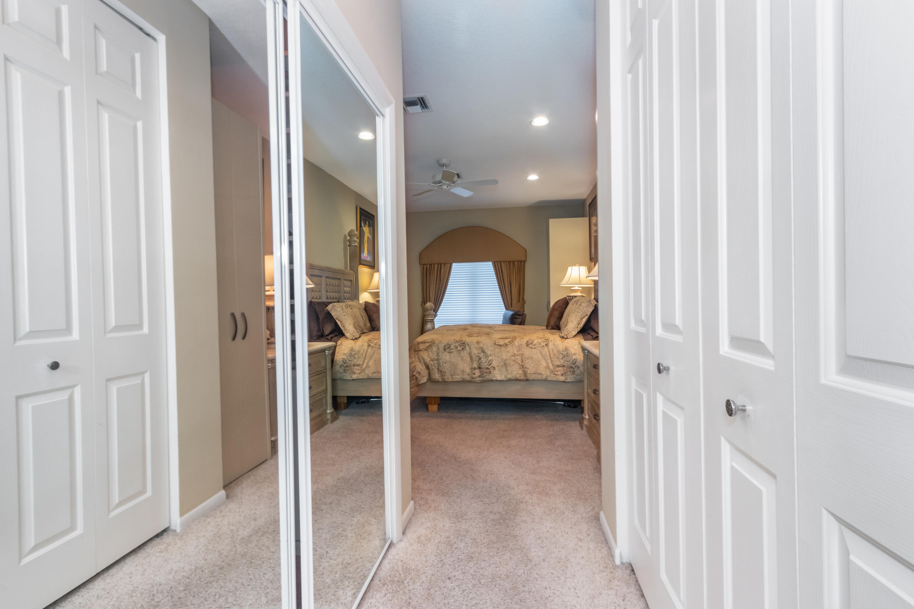 23402 Torre Circle Boca Raton, FL 33433 - Photo 19 of 44 a view of a bedroom with bed and window