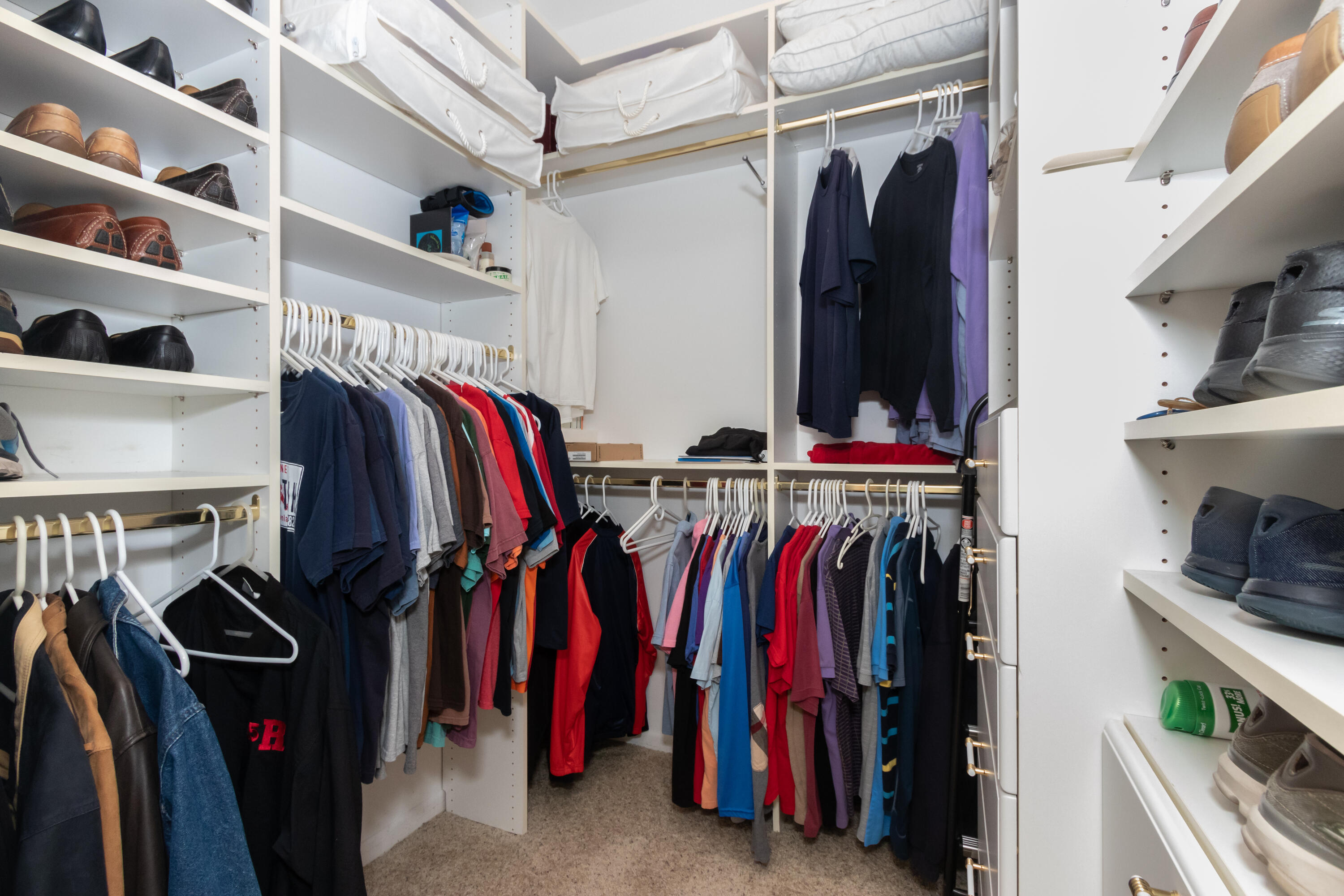 23402 Torre Circle Boca Raton, FL 33433 - Photo 23 of 44 a view of walk in closet with clothes and shoes