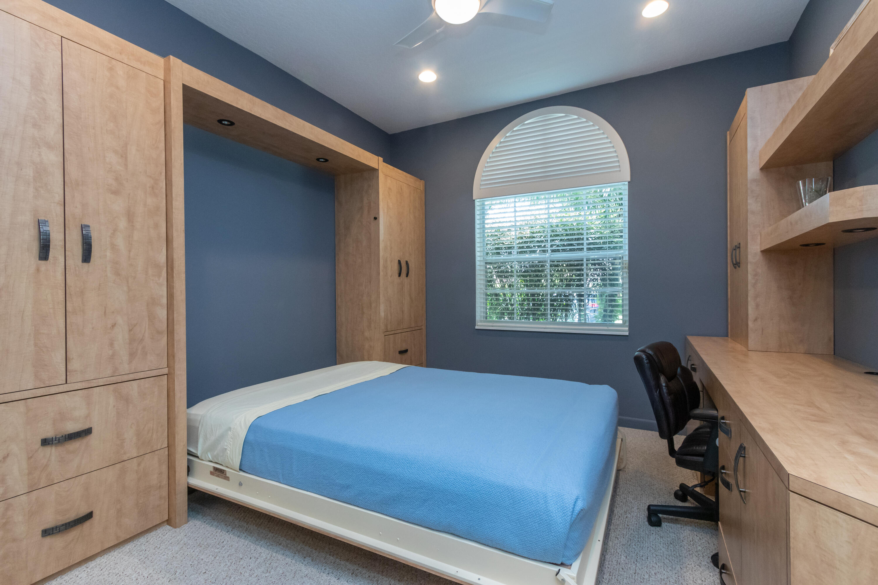 23402 Torre Circle Boca Raton, FL 33433 - Photo 26 of 44 a bedroom with a bed and a window